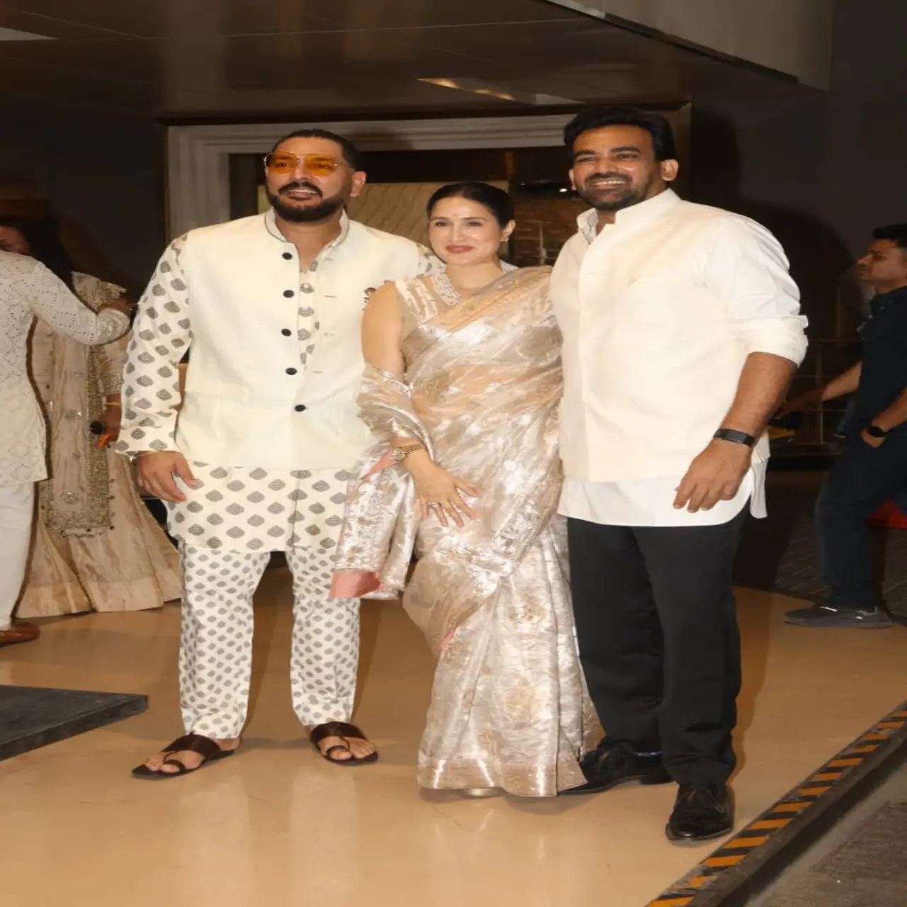 Yuvraj Singh was all smiles as he posed with fellow cricketer Zaheer Khan and his actress wife Sagarika Ghatge